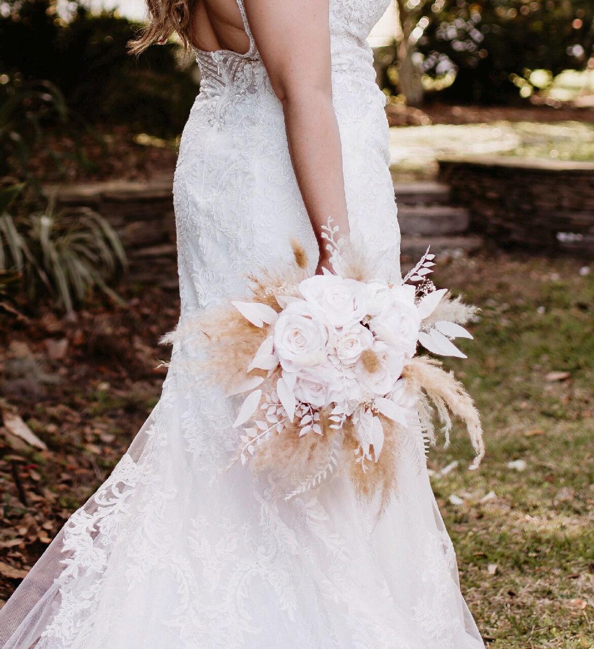 white bouquet with ivory dress A Cascading White Bouquet with Brooches
